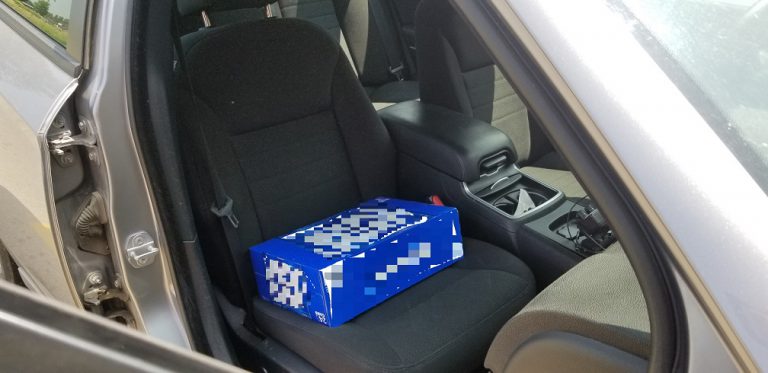 Police: Driver charged for having two-year-old child seated on a case of beer