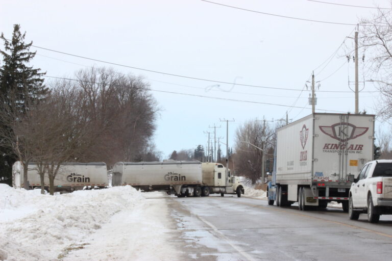 Grain truck gets stuck in snowbank Thursday in Stratford, snarling traffic